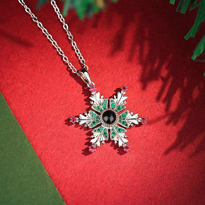 Shimmering snowflake necklace with projection of festive colors or Christmas languages