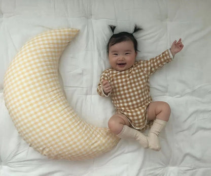 Moon-shaped baby nursing pillow in plaid cotton for newborns, available in yellow, green, and brown