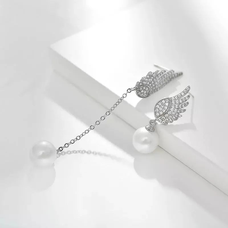 Platinum colour angel wing earrings with gemstone settings on diamond-treated silver