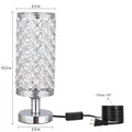 Modern crystal table lamp with metal base and hollow-carved shade in gold finish