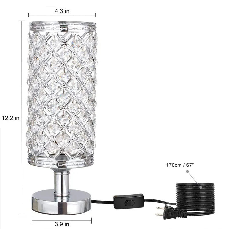 Modern crystal table lamp with metal base and hollow-carved shade in gold finish