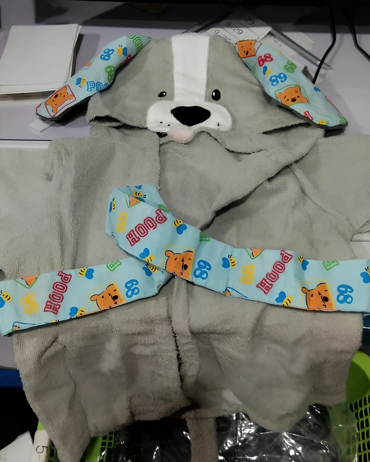 Cotton baby bathrobe with animal hood showing panda design, belt fastening, and absorbent fabric