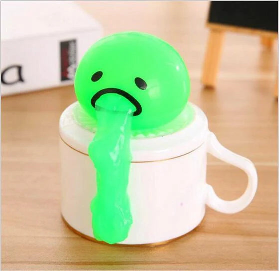 Gudetama Vomiting Egg Toy in green, orange, pink, and yellow