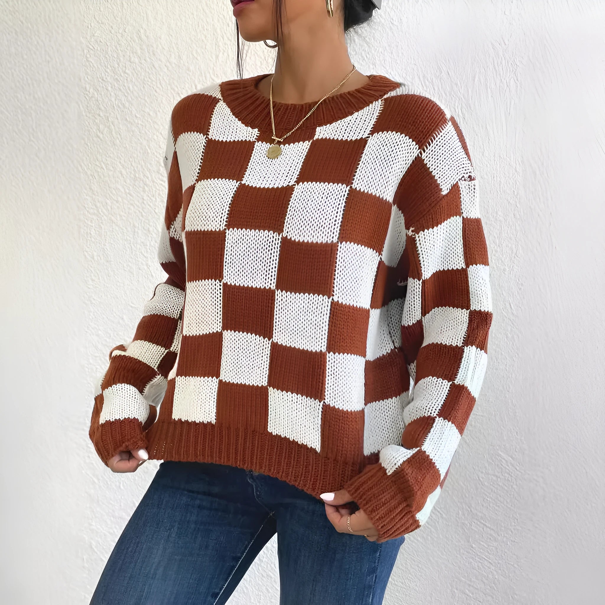 Dark brown plaid pattern acrylic loose pullover sweater with long sleeves and round neck.