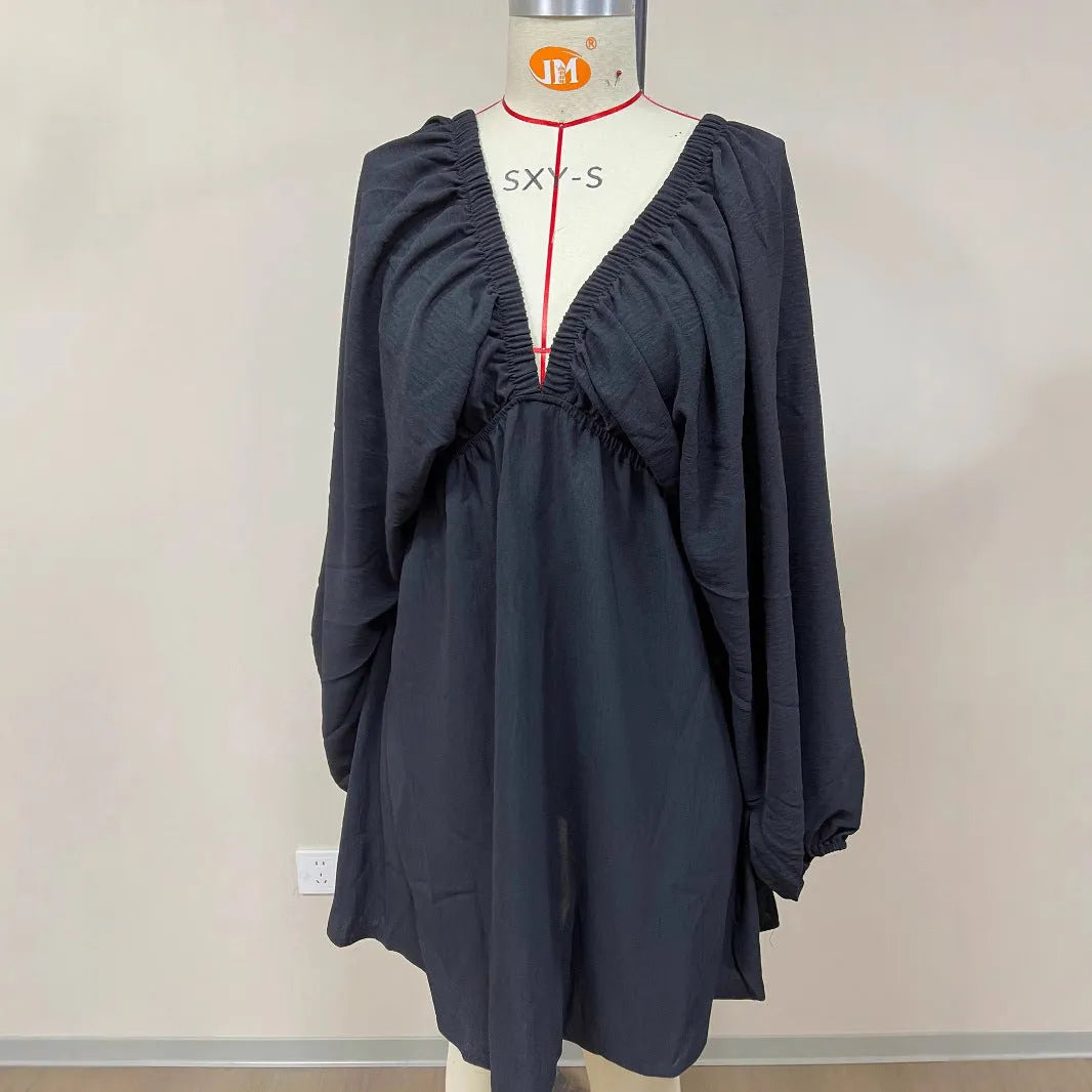 Women's apricot V-neck dress with long puff sleeves and a flounced swing skirt, mid-waist design.