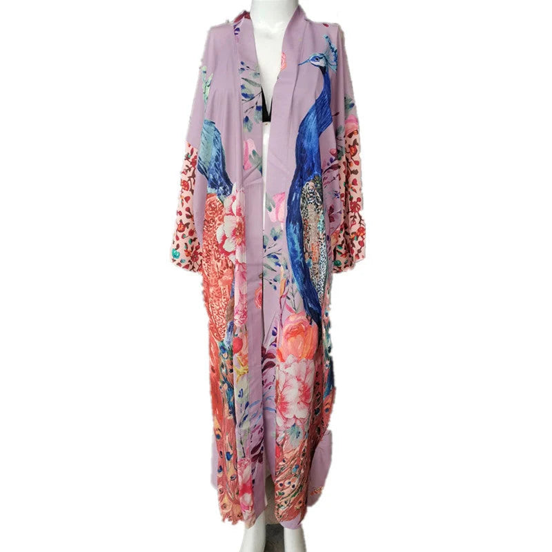 Peacock print beach cover-up in light pink and milky white, offering sun protection and style