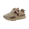 Women's black retro platform sports shoes with round toe and lace-up front on white background