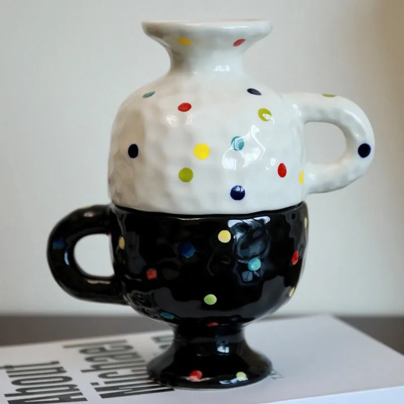 Hand-pinched irregular ceramic mug in a solid colour on a plain background.