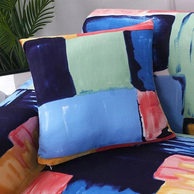 Printed stretchable sofa slipcover covering a three-seater sofa in a modern geometric pattern
