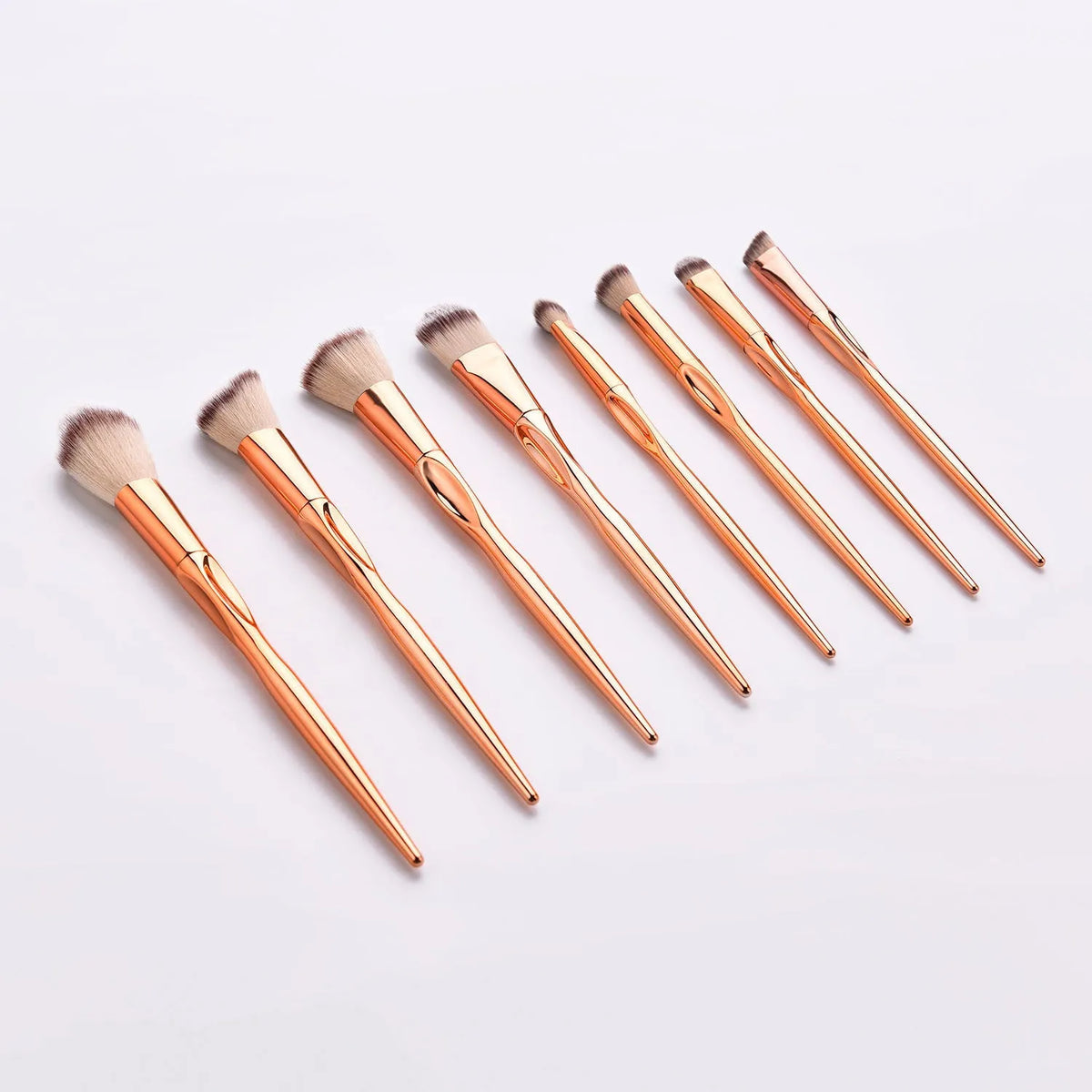 8-piece makeup brush set with nylon bristles, rose gold heart type handles, 22cm long, gold colour