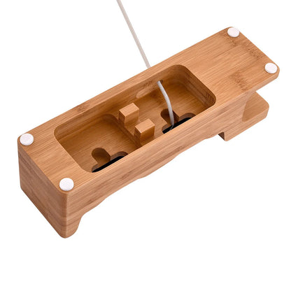 Carbonized bamboo dual phone and watch holder on a desk