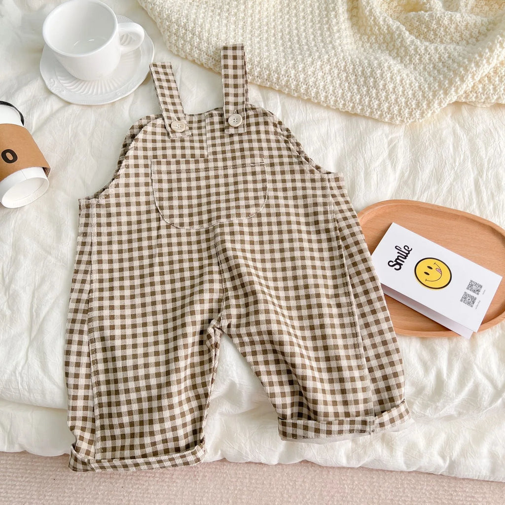 Infant plaid corduroy overalls in creamy-white with large pockets and double breasted closure