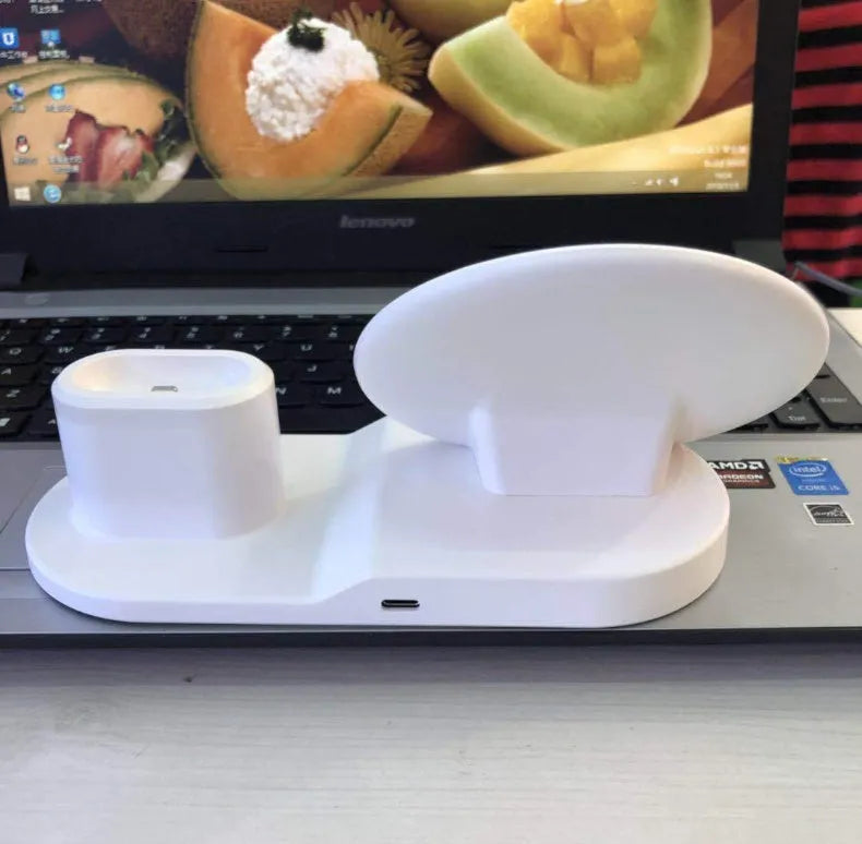 3 in 1 wireless charger stand in black holding a phone, smartwatch, and headphones