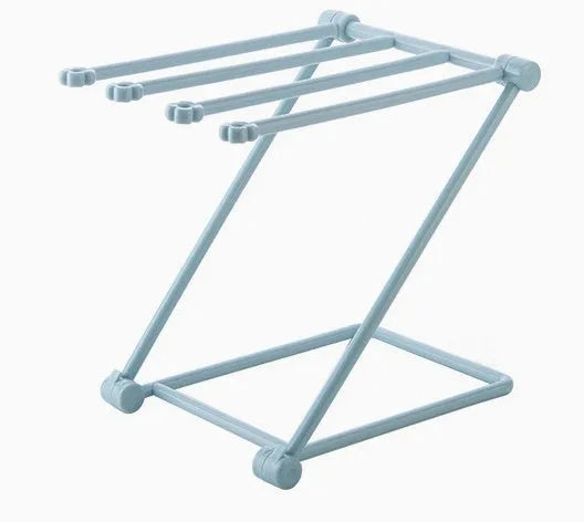 Foldable plastic dishcloth shelf in Nordic colours for kitchen bottle storage