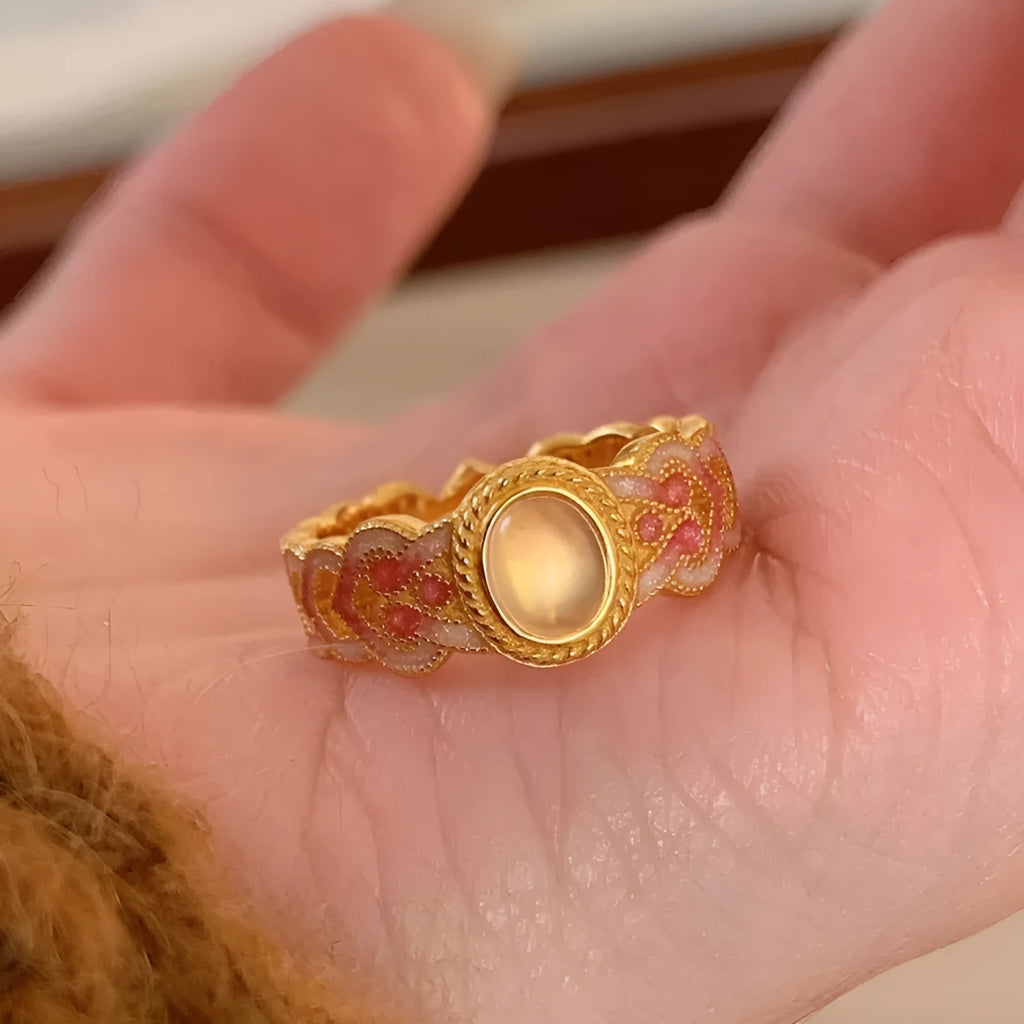 Pink crystal enamel geometric open mouth ring on a gold-plated copper band.