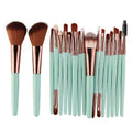 MAANGE 18-piece professional makeup brush set with black and silver handles and a fan contouring brush.