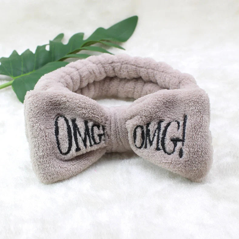 Coral velvet butterfly end hair band in pink with text styling, showing butterfly ends and cloth material