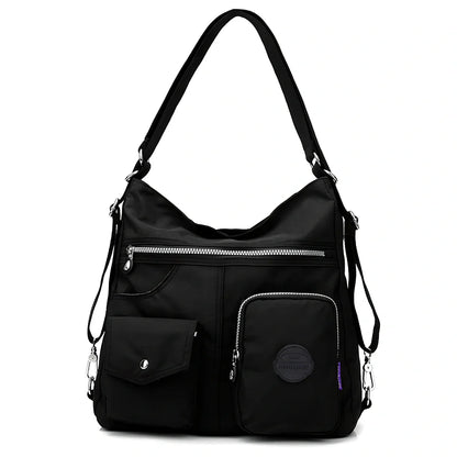 Women's waterproof nylon crossbody bag with organizational pockets and 34cm laptop capacity