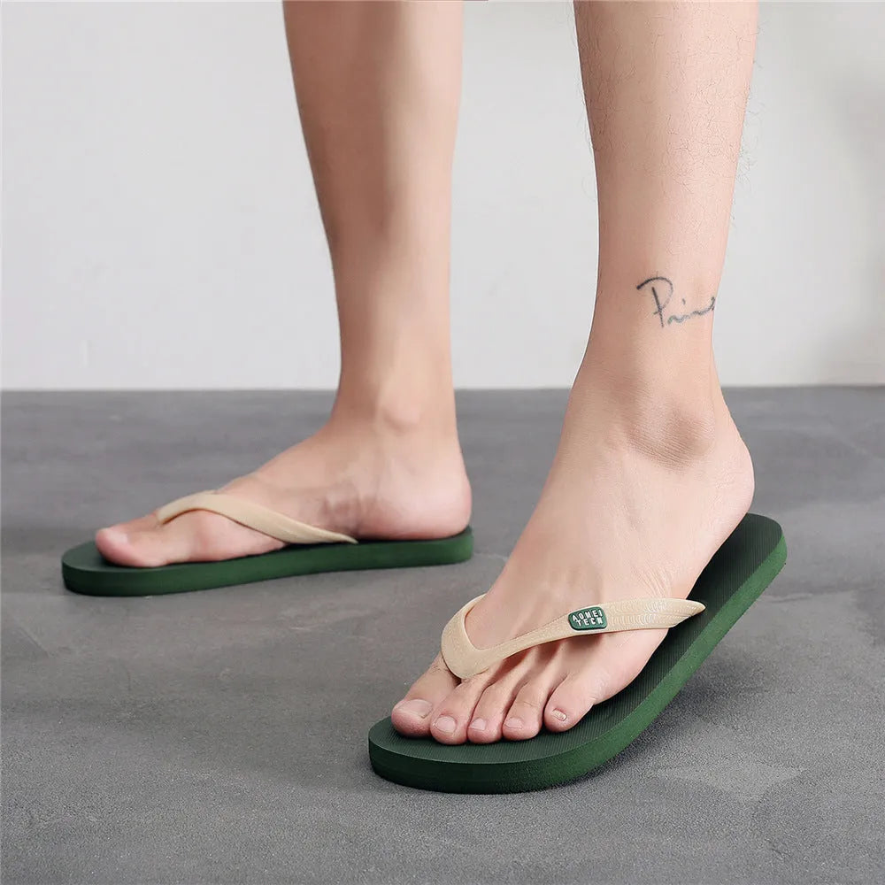 Men's flip-flops with rubber sole and EVA upper in black, green, orange, and grey colour options.