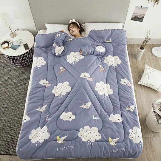 Cozy fleece-lined blanket with sleeves in various colors and designs, providing warmth and comfort for cold weather use.