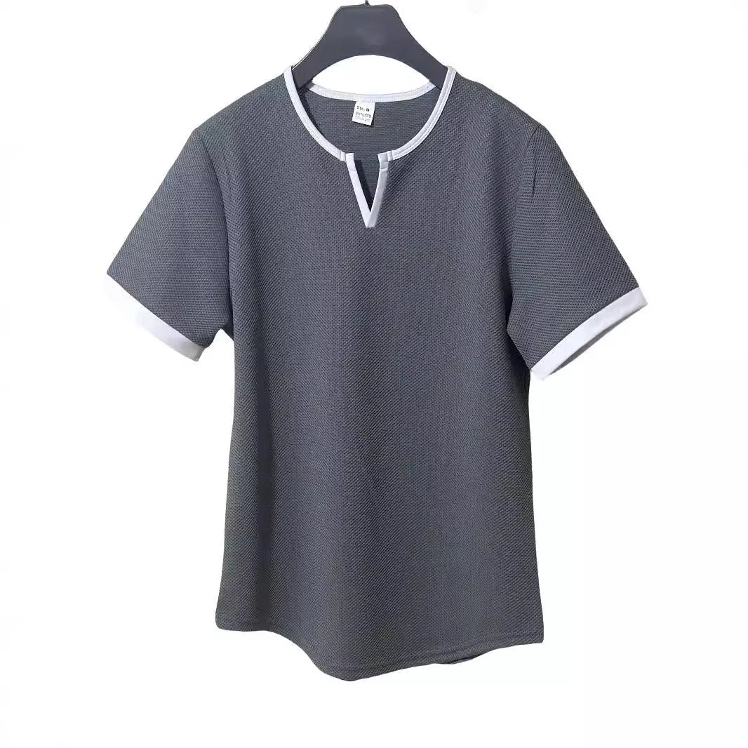 Colour-block V-neck sports t-shirt in waffle-knit polyester fabric on a hanger.