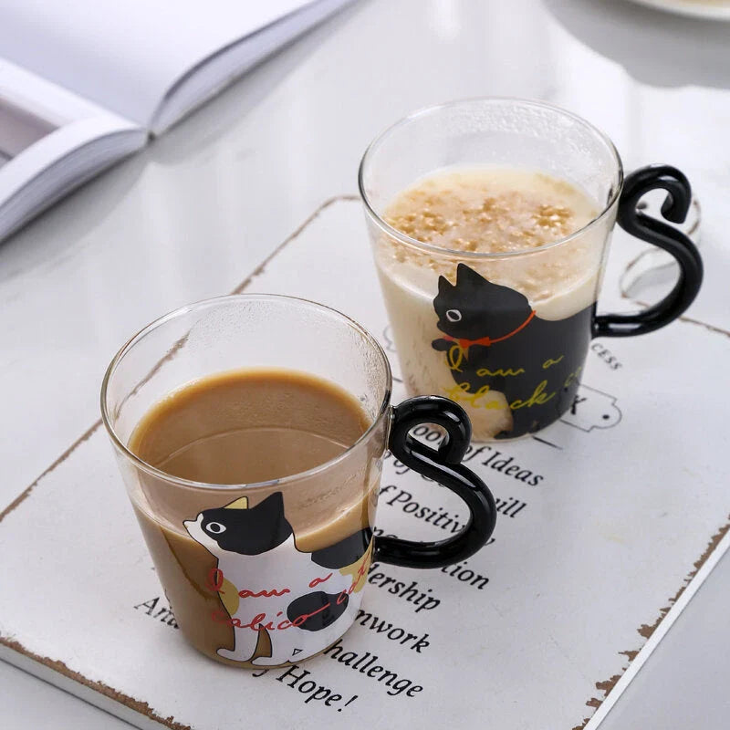 Adorable cat-themed glass mug with tail-shaped handle, perfect for hot and cold beverages