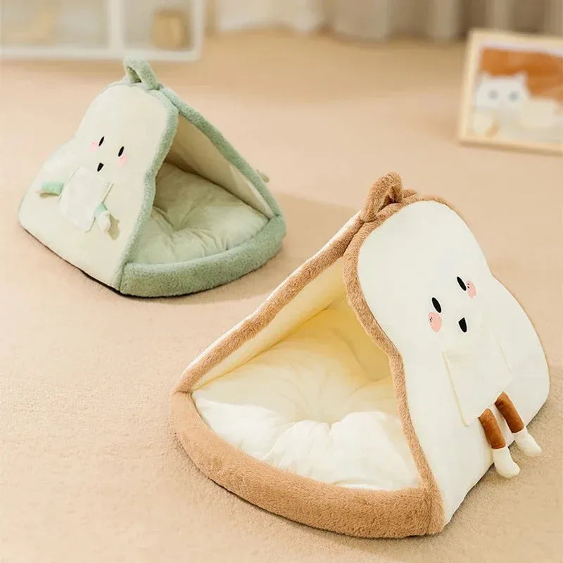 Green insulated cat tent pet bed with fleece blanket, shown in a home setting.