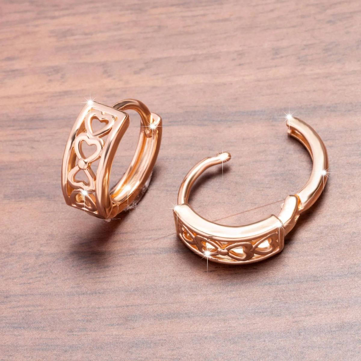 Love Glossy Hollow Ear Clip in rose gold copper electroplated earrings on display
