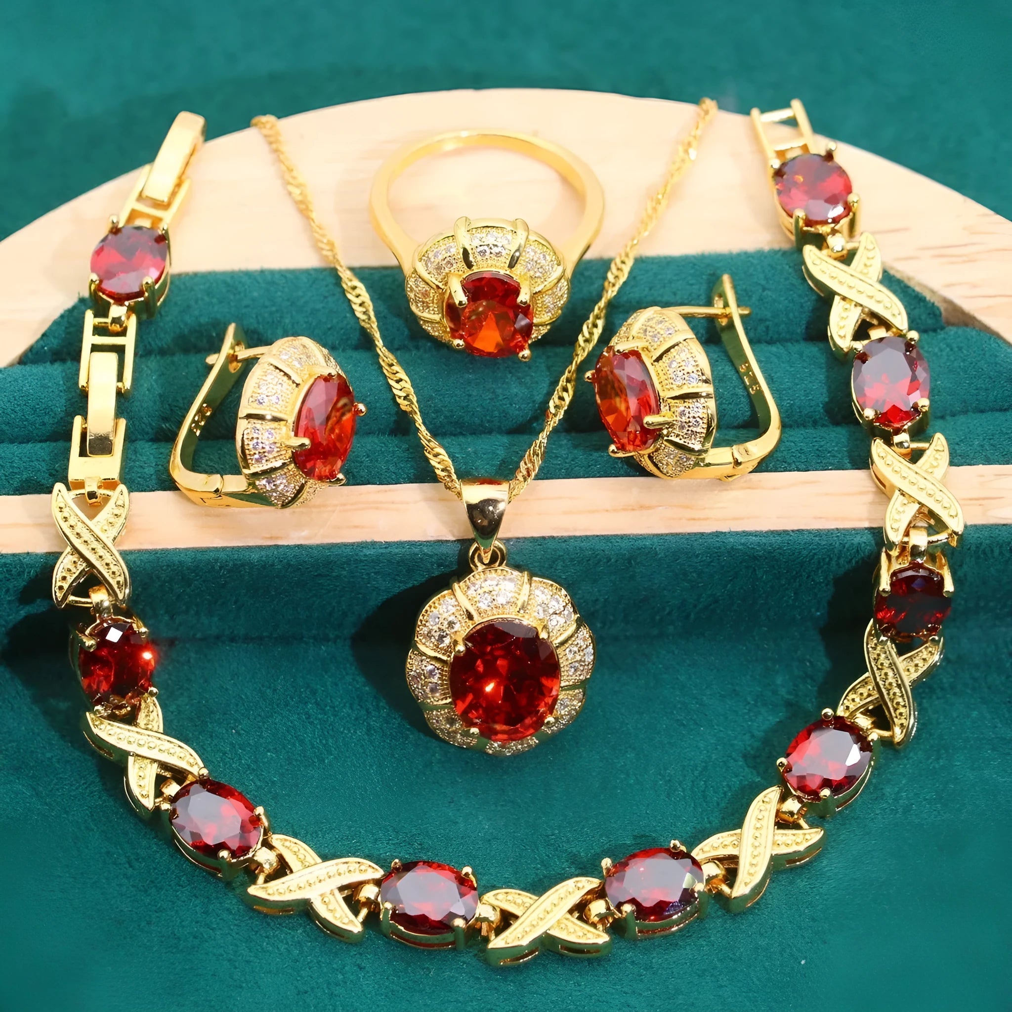 Gold plated jewellery set with coloured cubic zirconia stones showing necklace, earrings, ring, and bracelet.