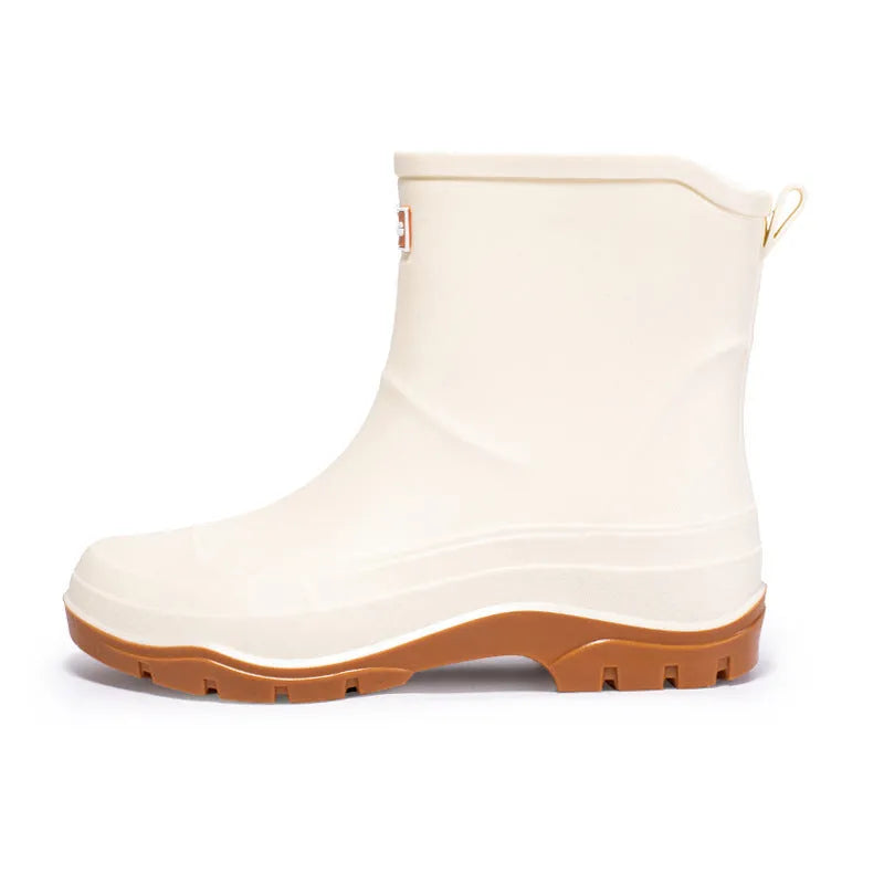 Women's short waterproof rubber shoe with non-slip sole in white colour on a flat heel.