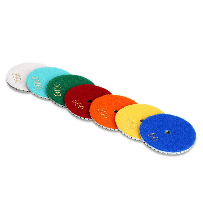 Set of 10 stone polishing pads showing different grits, 80mm diameter with 10mm centre holes