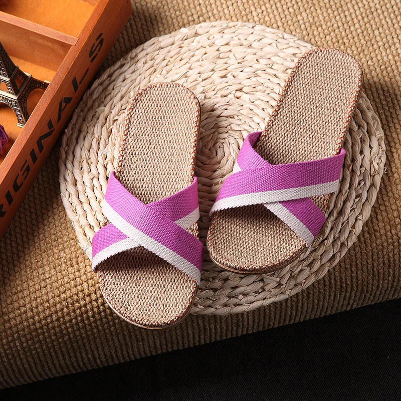 Linen open-toe home slippers with EVA sole in woven blue colour on a light background