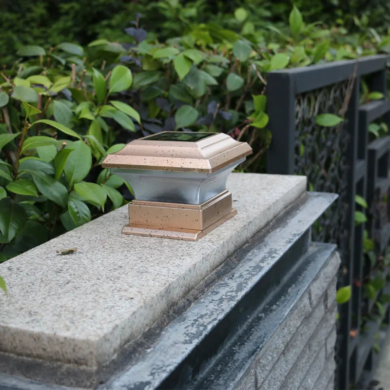 Outdoor solar column headlight with LED warm yellow light on a garden post