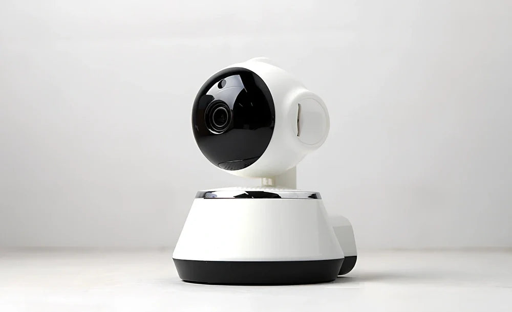 White WiFi baby monitor camera with 720P lens, pan-tilt base, and IR night vision for nursery monitoring
