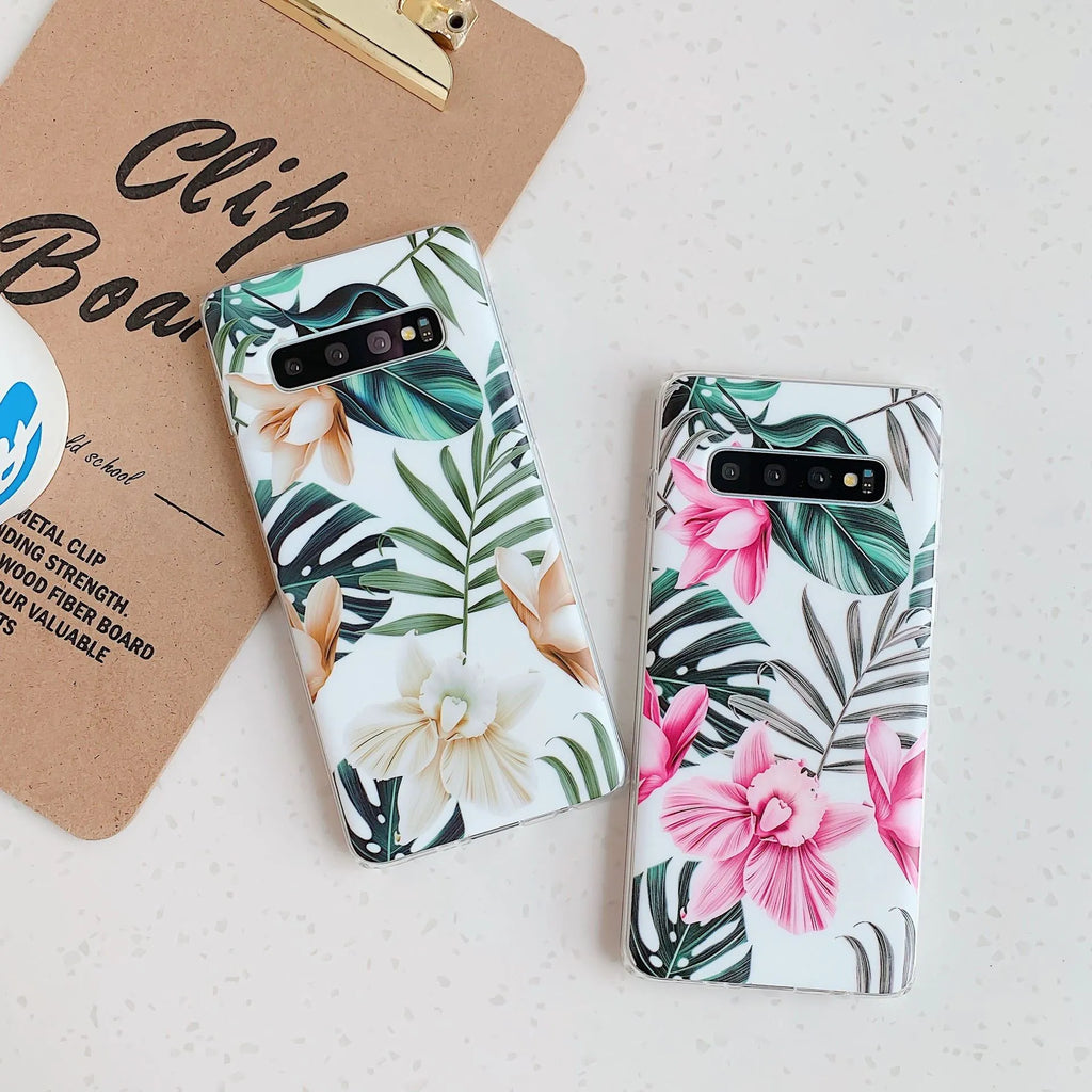 Green leaf flower patterned TPU phone case for Samsung Galaxy phones on a table.