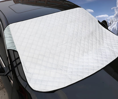 Silver magnetic windshield cover showing aluminium foil coating and edge magnets for vehicle protection