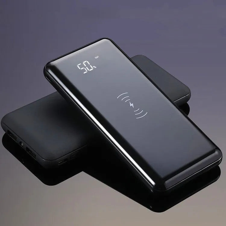 Multifunctional mirror wireless charger with silver mirror finish and built-in lithium battery on a wooden desk.