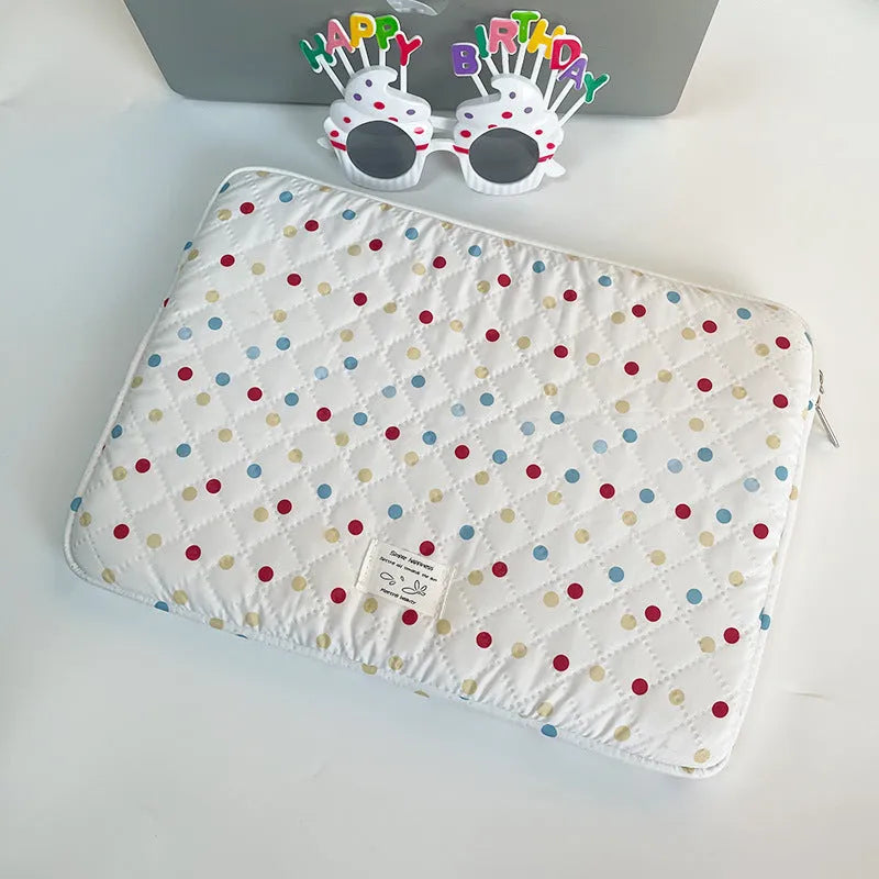 Women's polka dot polyester laptop bag shown in a solid colour, suitable for a 15.6 inch device.