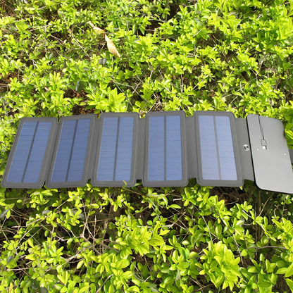 8W folding solar charger with expanded monocrystalline panel showing USB output port