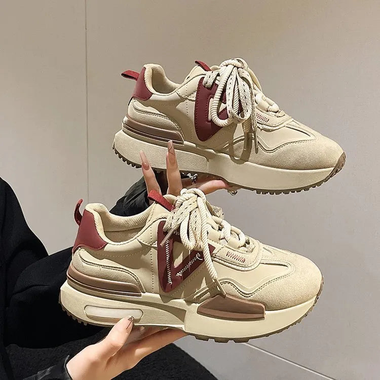Women's black retro platform sports shoes with round toe and lace-up front on white background