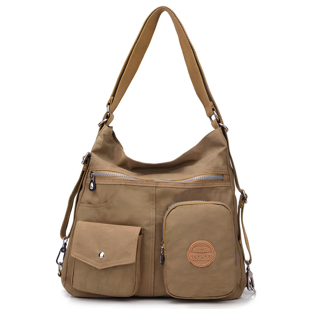 Women's waterproof nylon crossbody bag with organizational pockets and 34cm laptop capacity