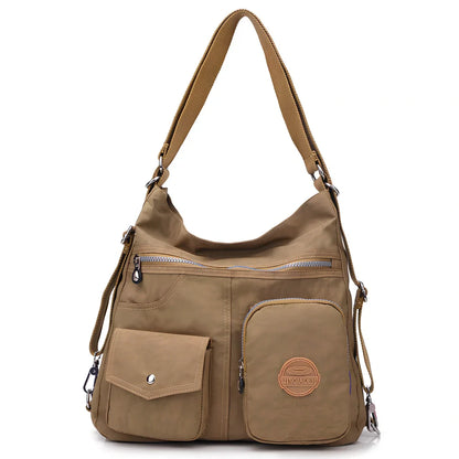 Women's waterproof nylon crossbody bag with organizational pockets and 34cm laptop capacity