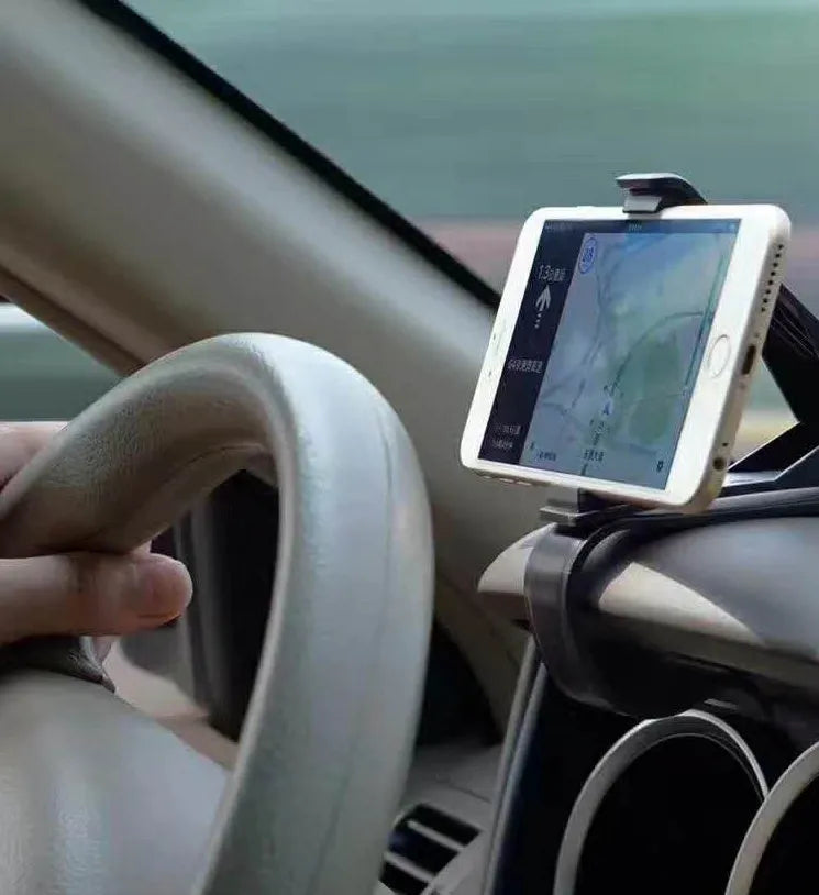 Black G-40 car bracket attached to steering wheel holding a mobile phone for navigation