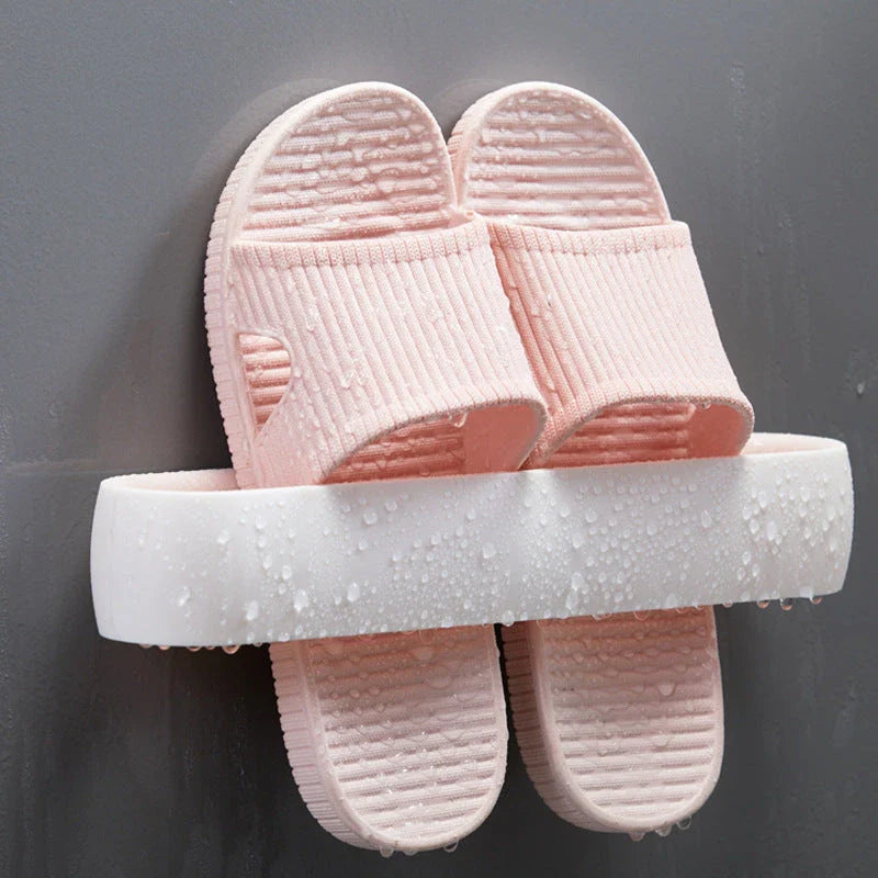 Wall-mounted bathroom slippers in pink, blue, and grey, made from 100% new plastic materials