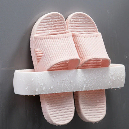 Wall-mounted bathroom slippers in pink, blue, and grey, made from 100% new plastic materials