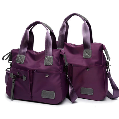 Ladies shoulder bag in black Oxford fabric, size M with multiple pockets and adjustable straps for handbag or crossbody carry, 340 mm width