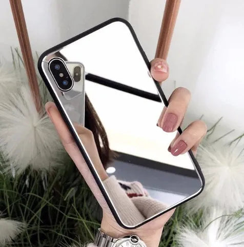 Black iPhone mirror phone case with reflective back cover for iPhone X and other models.