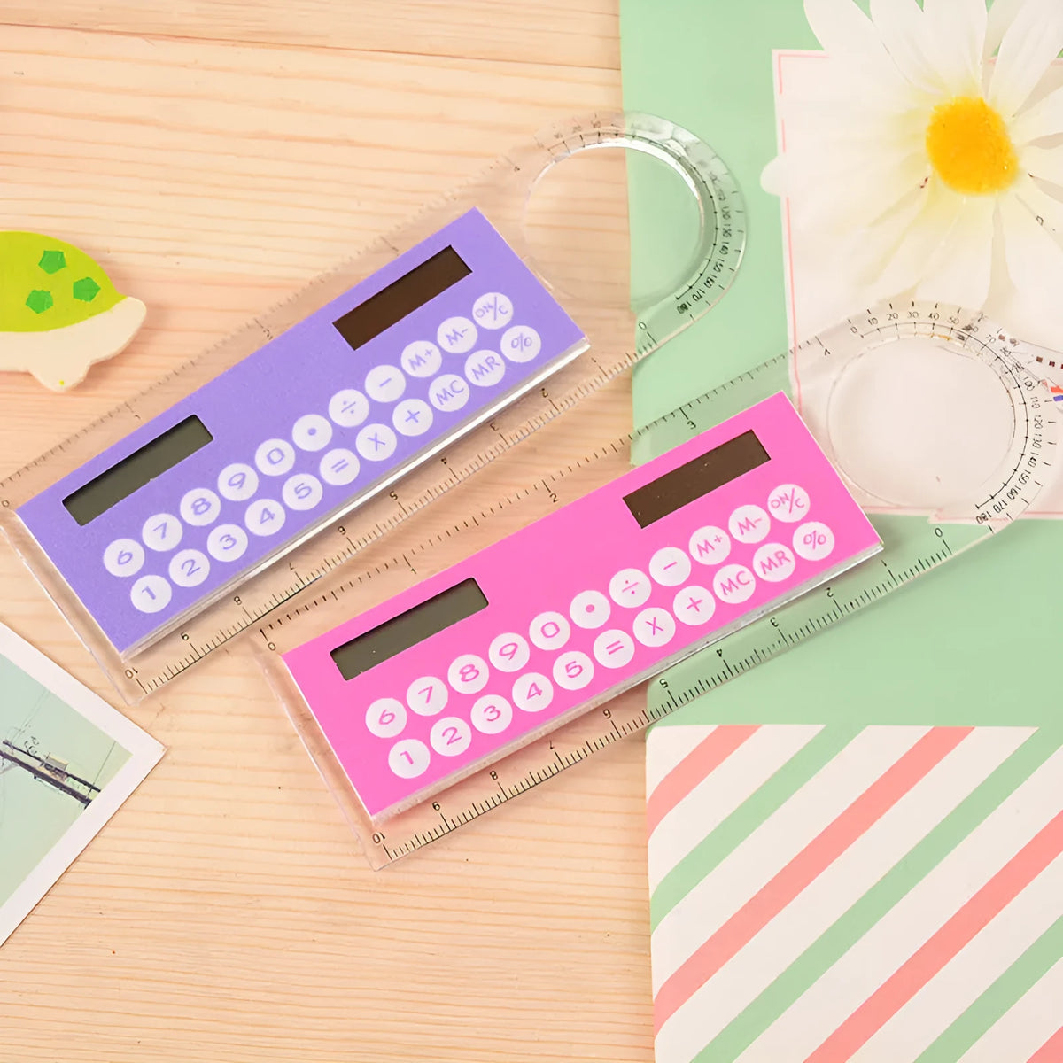 Solar powered mini ruler calculator with transparent touchscreen screen and 8-digit display on a white background