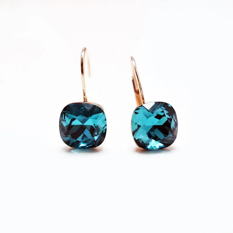Austrian crystal geometric copper ear studs for women in champagne gold colour