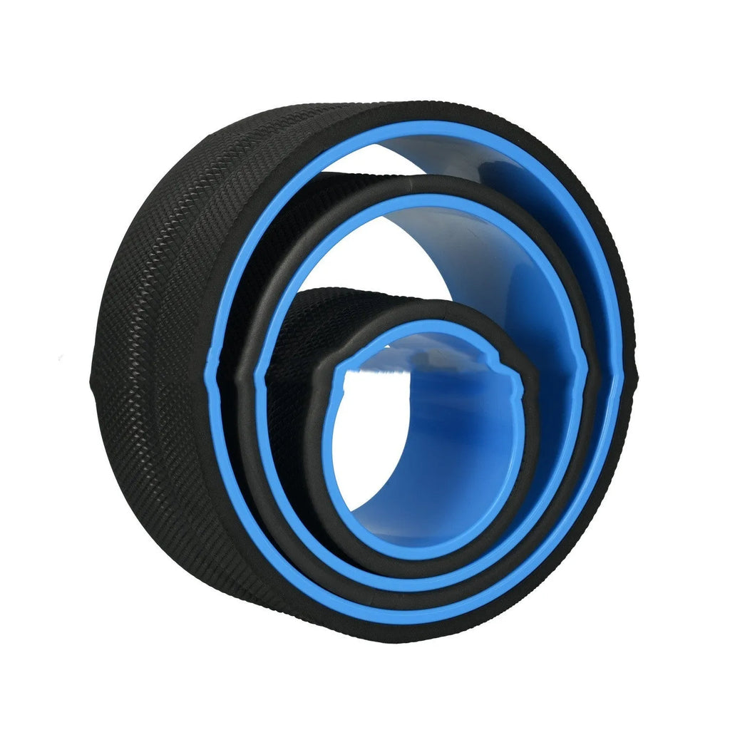 Black yoga wheel four-piece set with foam roller, Pilates ring, and stretching strap on a floor